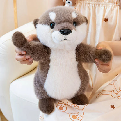 doudou loutre marron blanc bras ouvert