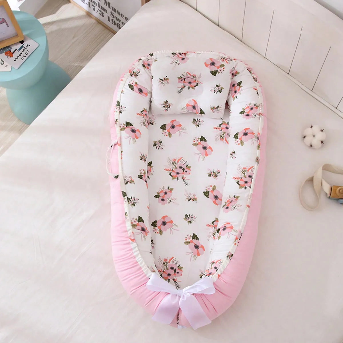 reducteur de lit bebe fleur rose