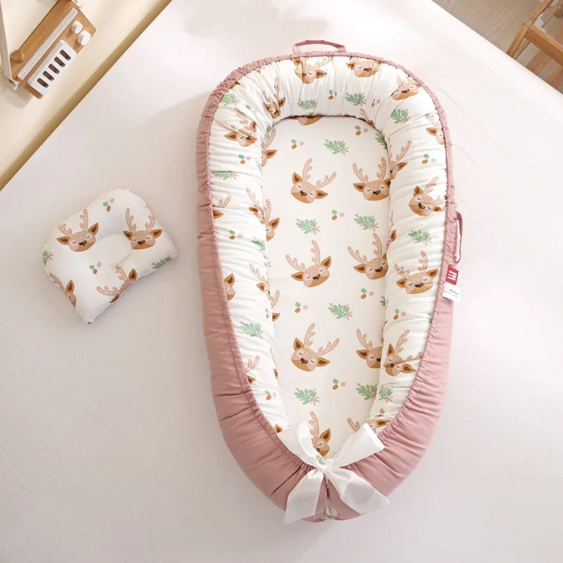 reducteur de lit bebe rose poudre cerf