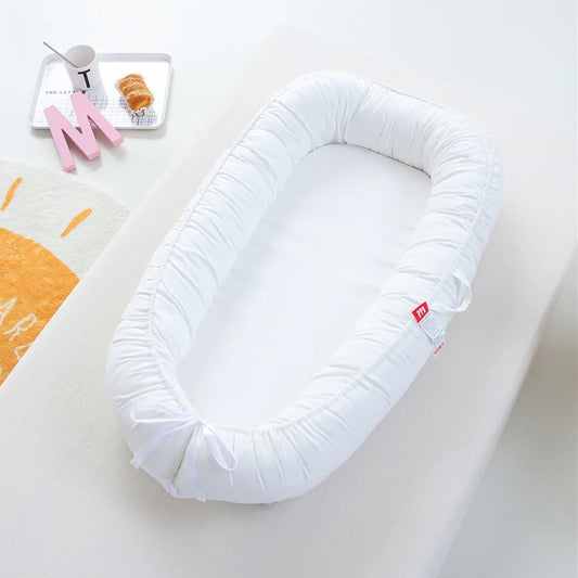 reducteur de lit blanc pour bebe