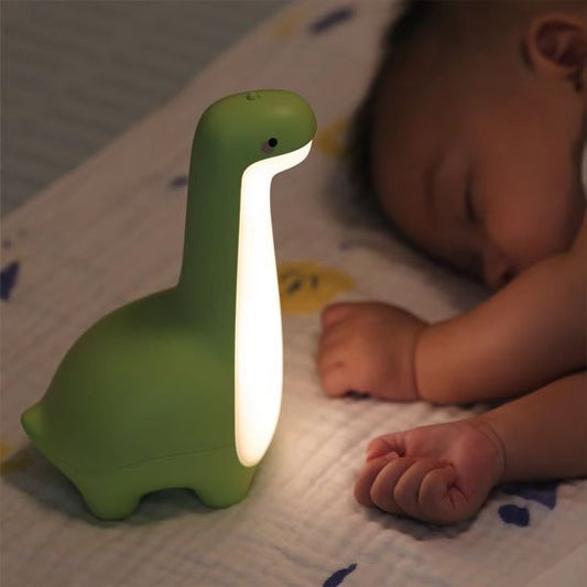Veilleuse bébé dinosaure vert bébé dort